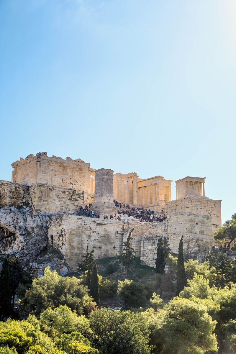 The Parthenon and Acropolis above Athens under a blue sky